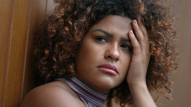 istock Pensive Brazilian woman thinking close-up face 1360344802