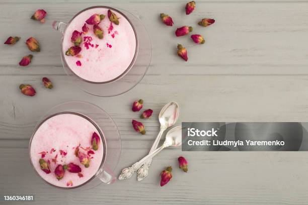 Top View Of Rose Moon Milk In Two Cups On The Gray Wooden Background Copy Space Stock Photo - Download Image Now