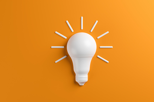 Concept idea innovation light bulb on orange background. 3D rendering.