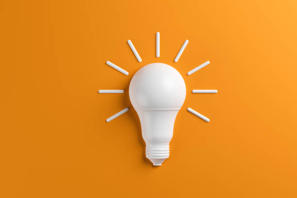 Concept idea innovation light bulb on orange background. stock photo