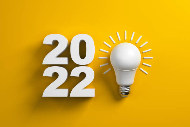 istock 2022 and white lamp on a yellow background. 1360347597