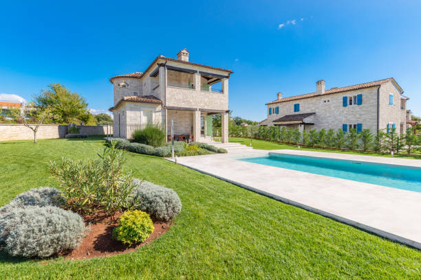 istock Luxurious beautiful modern villa with swimming pool and yard garden 1360348110