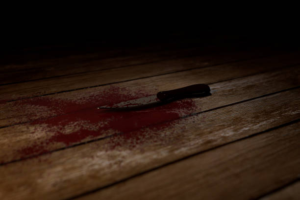 3D Horror Illustration Of a Bloody Knife On a Wooden Floor Version 2 stock photo