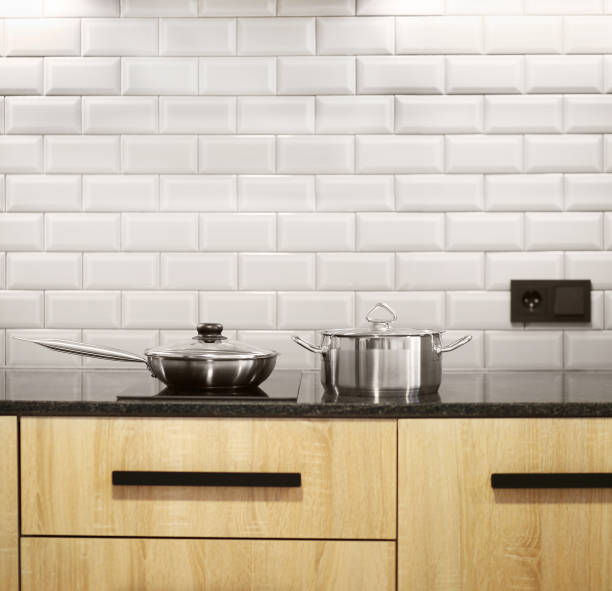 istock Steel pan and stewpan standing on kitchen stove 1360350493