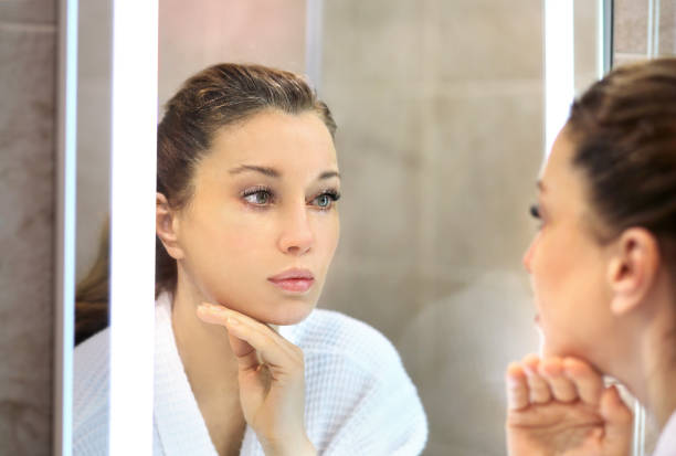 istock Magic anti-aging cream.Applying the cream. 1360350600