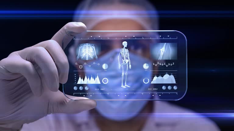 There are scientists in 4k resolution video. The hologram uses the services offered by technology from the screen. He is doing data analysis from the digital program. The man has a mask in his mouth, a cap on his head and a white glove in his hand. HUD graphical user interface