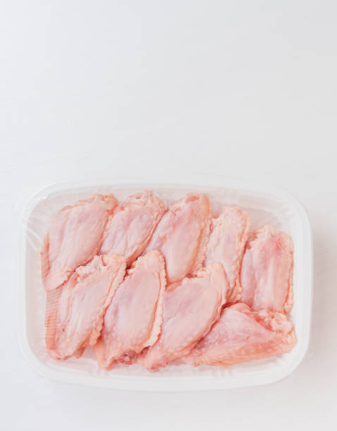 istock The chicken wings are in a plastic box. 1360350807