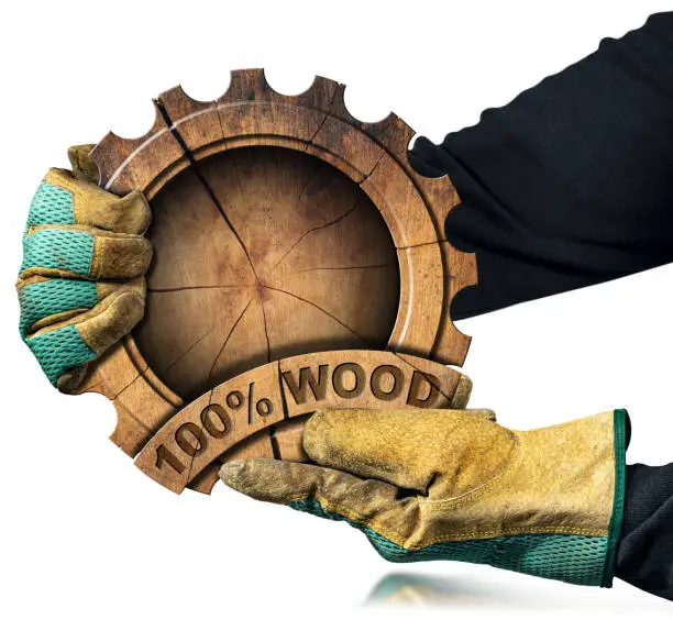 Photo of Gloved Hands Holding a Cogwheel with Text One Hundred Percent Wood