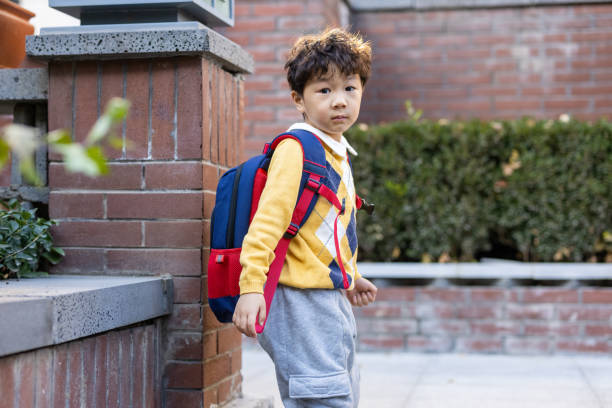 istock A little boy coming home from school 1360354178