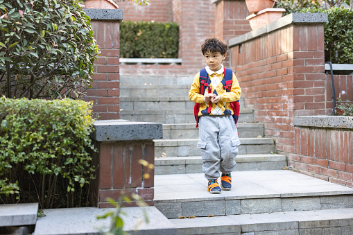 A little asian boy,go to school in the morning.canon R5 shooting.
