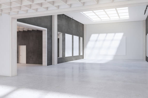 istock Clean concrete exhibition hall interior with empty posters and sunlight. Gallery concept. 3D Rendering. 1360358796