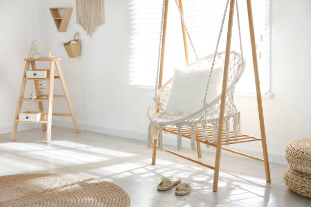 istock Comfortable hammock chair in stylish room. Home interior 1360360071