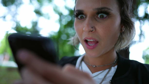 istock Woman reacting to shocking surprise on cellphone notification message 1360360292