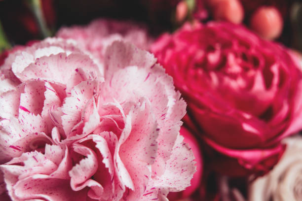 istock Beautiful bouquet with pink roses and carnation close up 1360362244