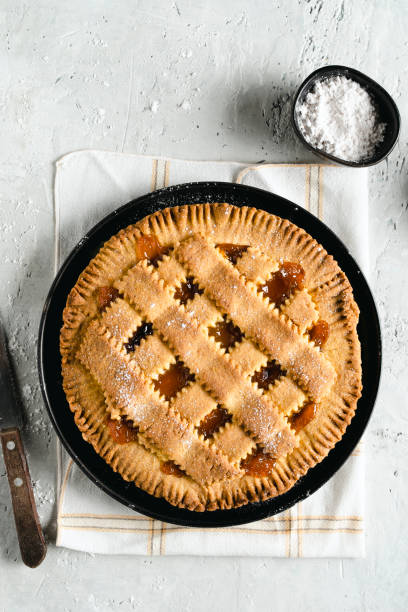 Homemade crostata with apricot marmalade Homemade, rustic, crostata sweet pie with apricot marmalade. To view. Copy space. crostata stock pictures, royalty-free photos & images