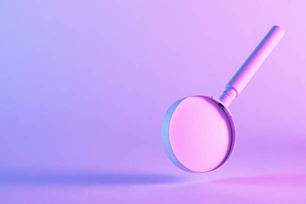 istock Dramatic duo-tone image of a floating magnifying glass 1360363390