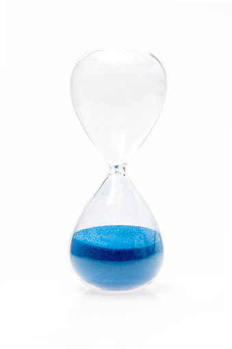 Empty blue hourglass on white with path