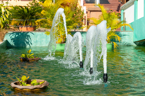 Water flow from the pipes of the fountain, pool pipe waste water, sponge small fountain, oxygenated water pipe.