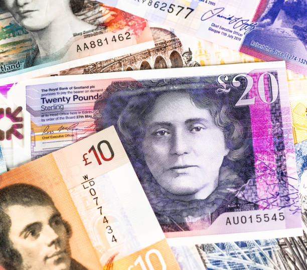 Scottish banknotes close-up Close-up of collection of Scottish £5, £10 and £20 notes, featuring famous Scottish people and places. twenty pound note stock pictures, royalty-free photos & images