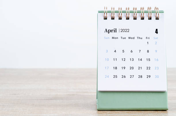 April 2022 desk calendar on white. The April 2022 desk calendar on white. april stock pictures, royalty-free photos & images