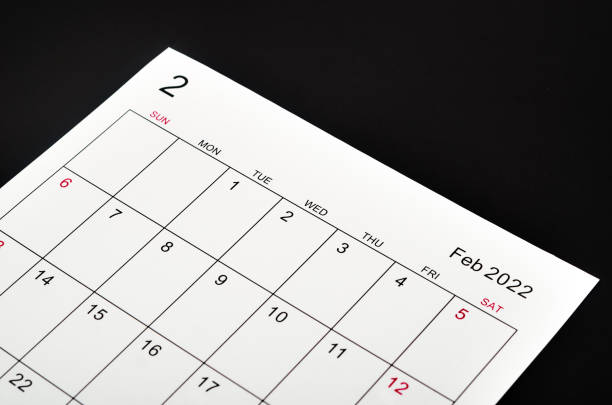 istock February 2022 calendar sheet on black background. 1360366240