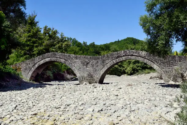 Greece, Epirus, medieval Milos stone bridge over dry river bed