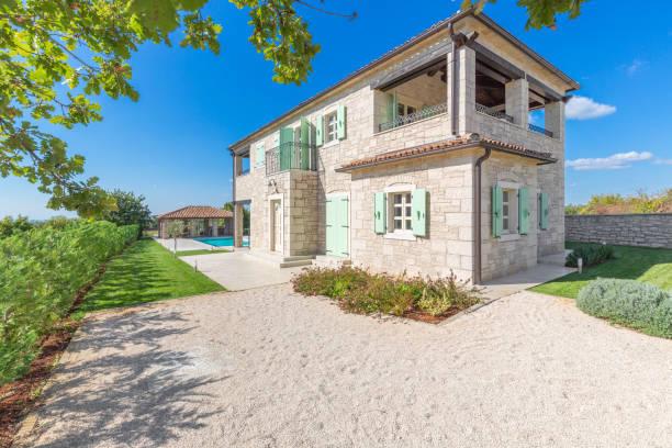istock Luxurious beautiful modern villa with swimming pool and yard garden 1360367715