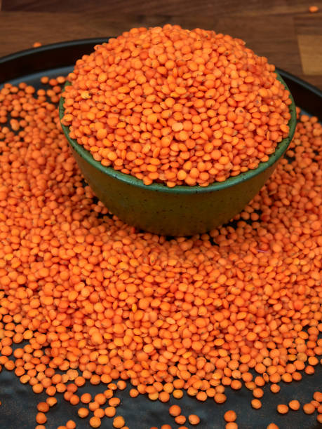 istock Red lentils in a green ceramic bowl 1360368429