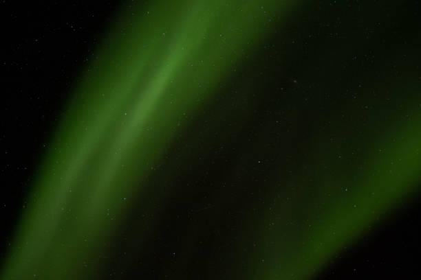istock Three shooting stars hidden in the northern lights 1360369101