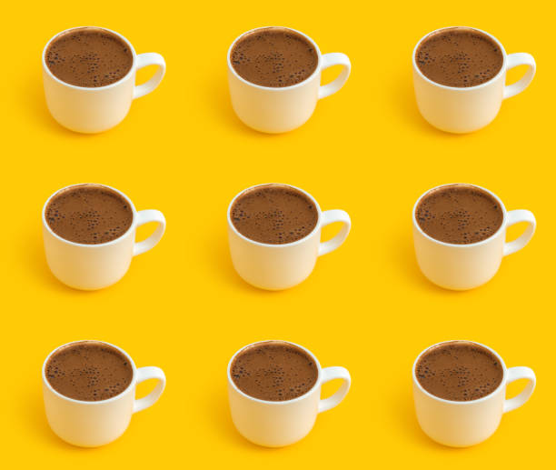 Coffee pattern on yellow background stock photo