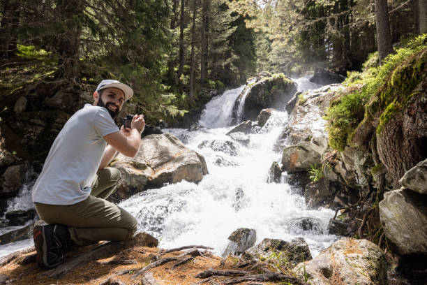 istock Photographer in the mountains 1360372606