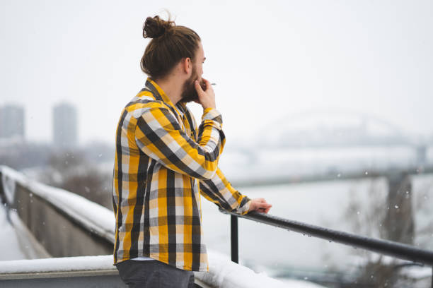 istock Man smoking outdoors 1360372937