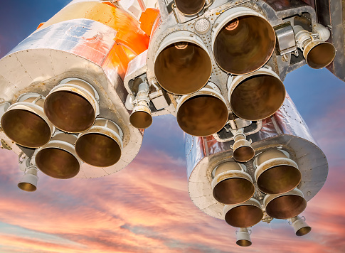 Space rocket engines of the russian spacecraft over blue sky background
