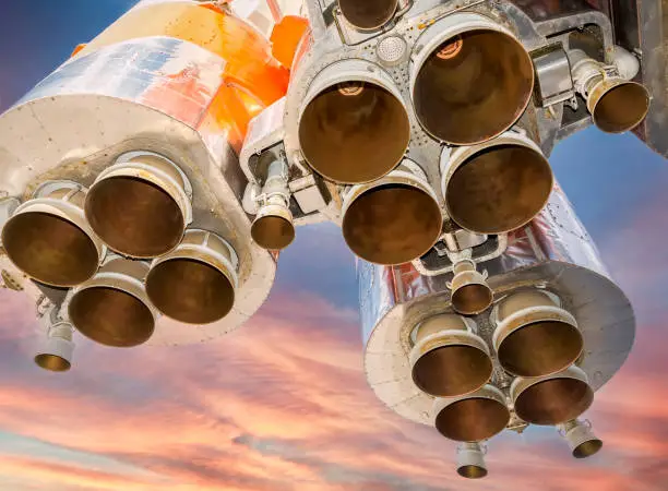 Photo of Space rocket engines of the russian spacecraft over blue sky background