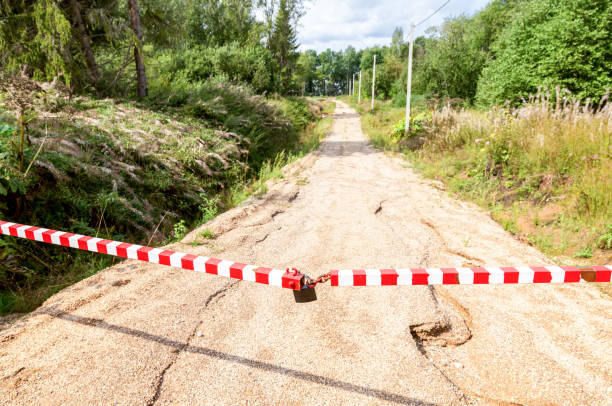 istock Road is closed with a chain and padlock, no entry 1360373850