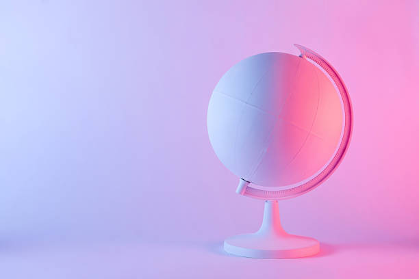 istock Model of a globe with blank map in pink light 1360380377