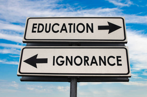 Education versus ignorance road sign stock photo