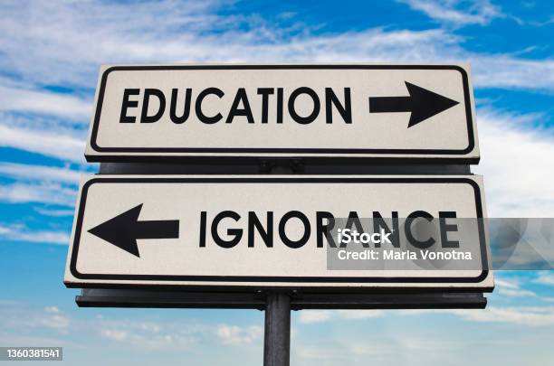 Education Versus Ignorance Road Sign Stock Photo - Download Image Now - Achievement, Arrow Symbol, Asking