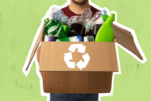 istock Contemporary art collage. Man holding box with different waste, garbage types with recycling sign over green background. 1360382940