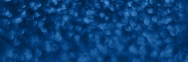istock Blue sparkling glitter bokeh background banner 1360382971