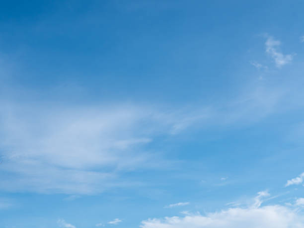 istock Blue sky background with white clouds on bright summer day. 1360383457