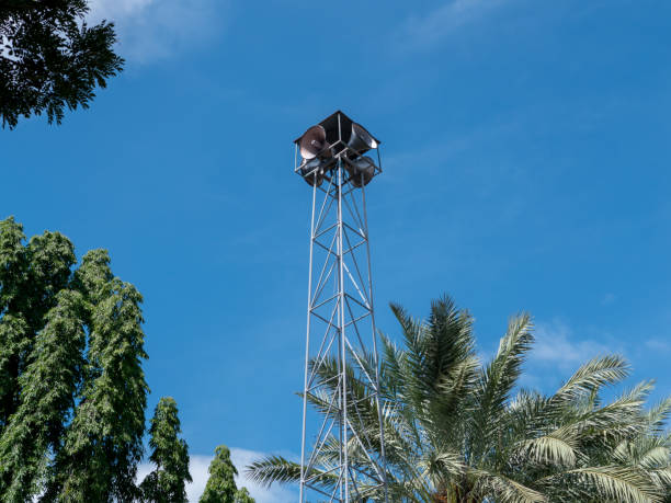 istock Megaphone or speaker on pole with blue white sky background outdoor. Communication, information, technology, advertising concept. 1360384041