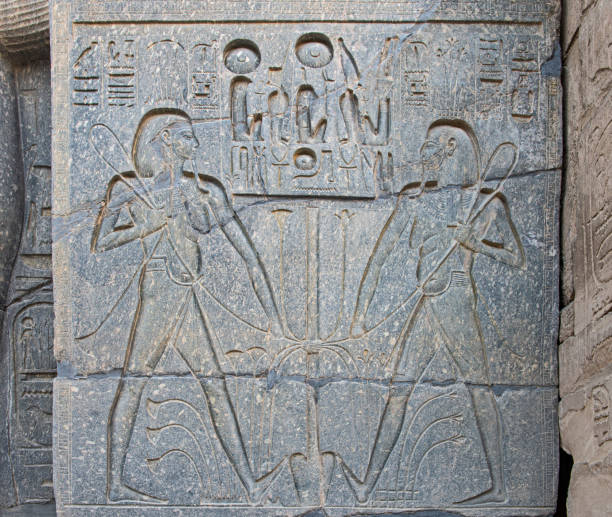 istock Hieroglyphic carvings on an ancient egyptian temple wall 1360384667