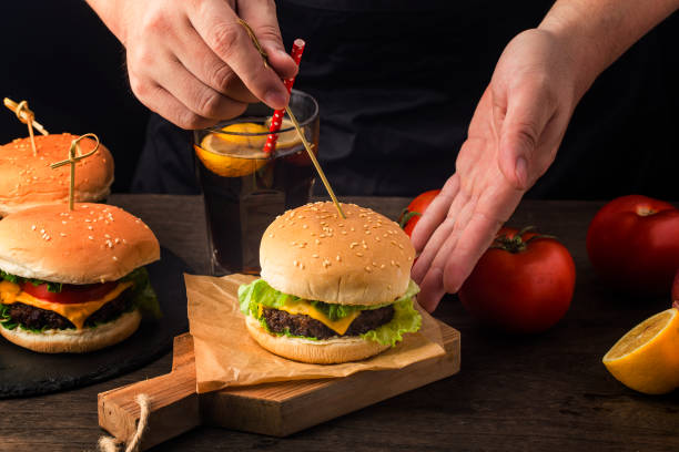Close up of a homemade delicious beef hamburger on a wooden table.