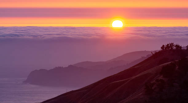 istock Sunset over the Pacific Ocean in Big Sur, California 1360386659