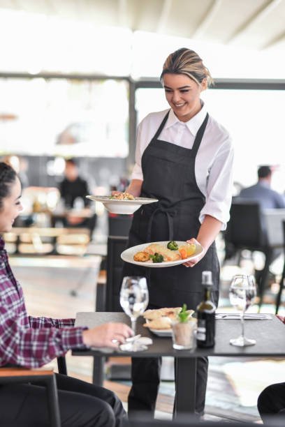 istock Couple Receiving Fancy Appetizer Before Main Course In Restaurant From Waitress 1360386996