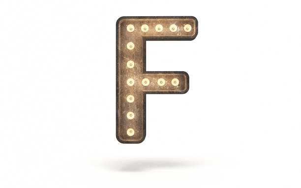 istock Letter F decorated with light bulb covered with concrete 1360387231