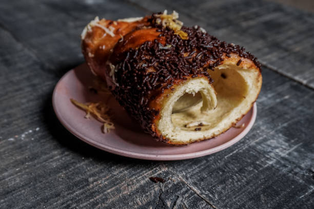 istock Bread with chocolate sprinkles on a pink plate 1360389492