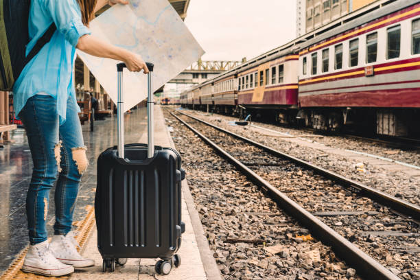 istock woman travel by train 1360390225