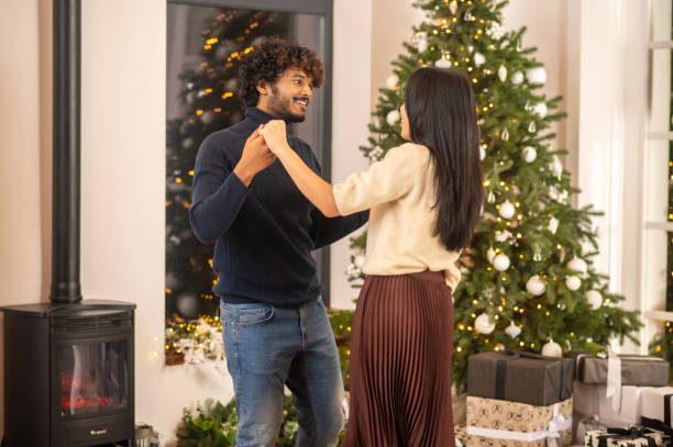 istock Man dancing with woman sideways to camera 1360390697